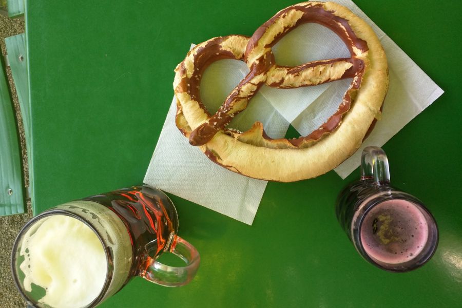A giant pretzel, beer and Johanisbeer Shorle at Munich's Chinesischer Turm in Englischer Garten.