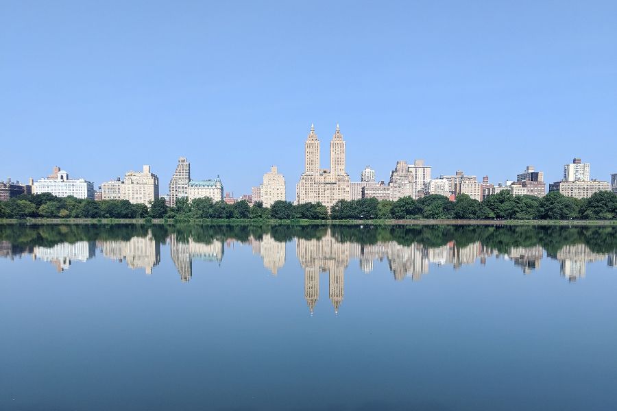 The New York City skyline and the Central Park Reservoir seen from the Upper East Side.