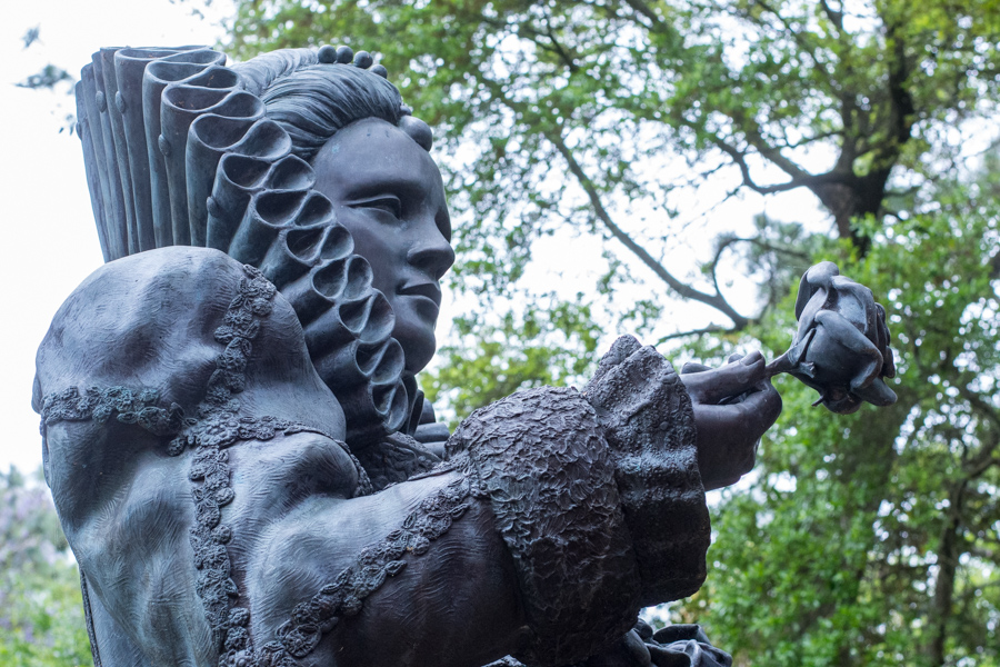 A statue offers a rose at the Outer Banks' Elizabethan Gardens.