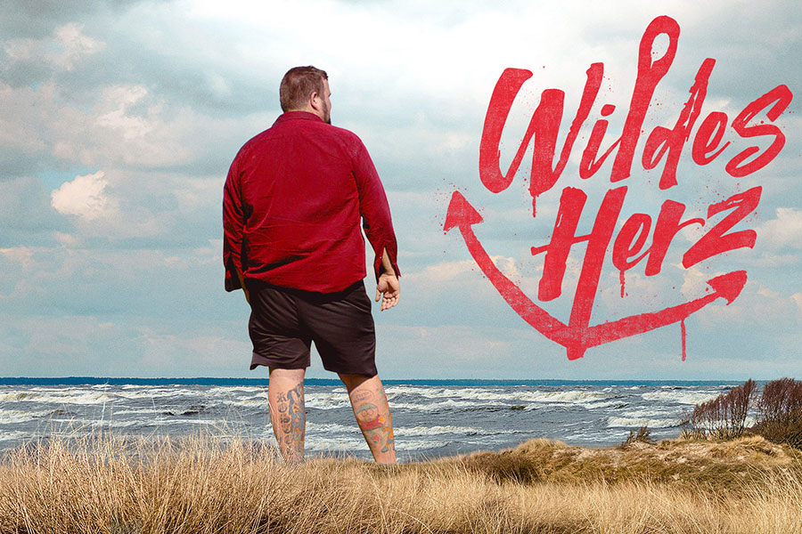Promotional image for the documentary Wildes Herz, co-directed by Charly Hübner, featuring the punk band Feine Sahne Fischfilet.