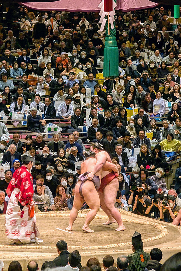 Sumo wrestlers (rikishi) Kirishima and Takayasu in a bout during the Grand Sumo Tournament in Tokyo.