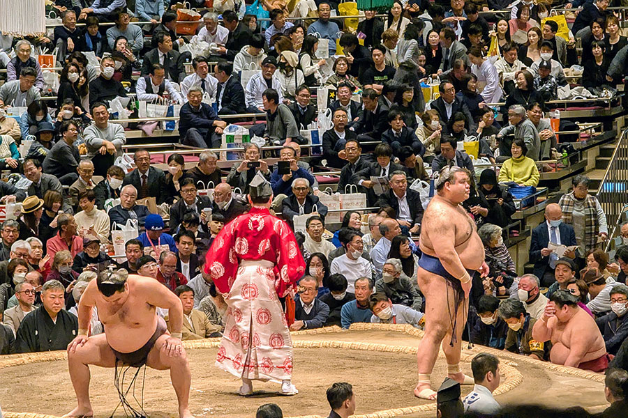 Sumo wrestlers (rikishi) Kirishima and Takayasu prepare for a bout during the Grand Sumo Tournament in Tokyo.