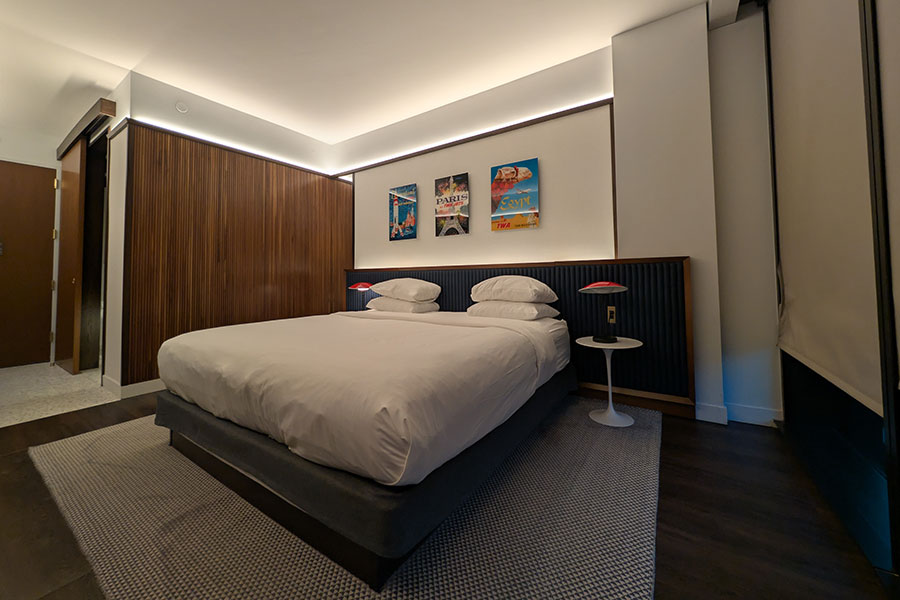 Deluxe king room at the TWA Hotel at JFK Airport with vintage travel posters and mid-century modern design