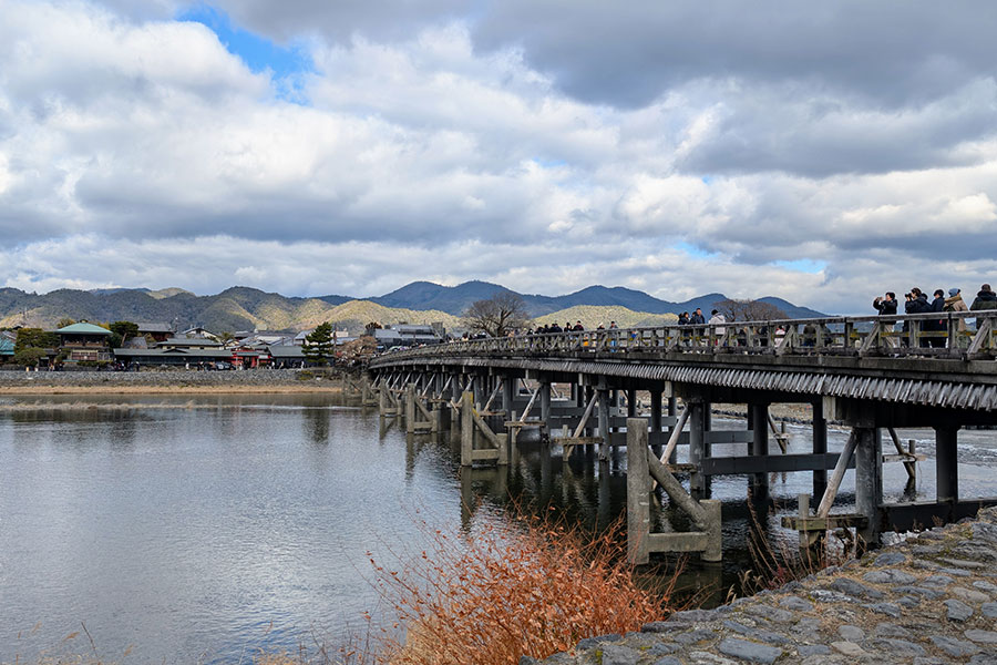 Togetsukyo Bridge stretching over the Katsura River in Kyoto’s Arashiyama district on a cloudy winter day