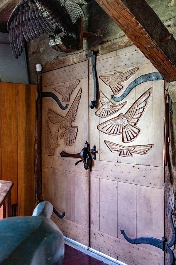 Hand-carved wooden door with bird motifs in the Wharton Esherick Studio at the Wharton Esherick Museum.