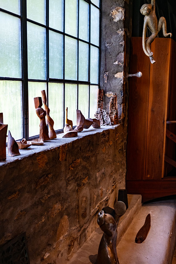 Wood sculptures by Wharton Esherick displayed on a windowsill inside the Wharton Esherick Studio at the Wharton Esherick Museum.