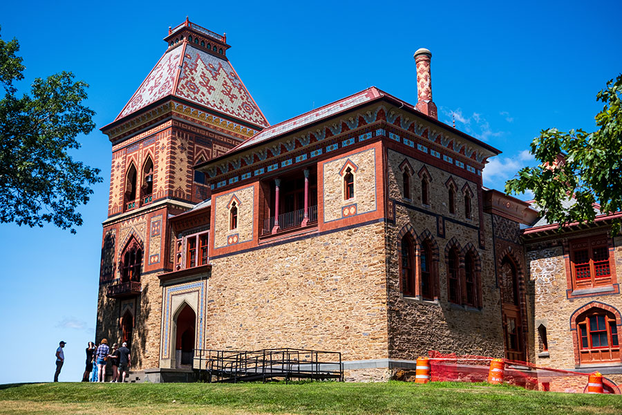 Visitors gather at the ornate, arched entryway of the Persian-style main house at Olana State Historic Site in Hudson, NY.