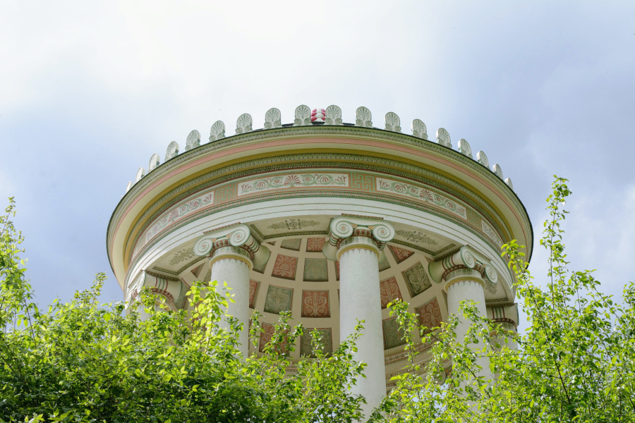 Close-up of the ornate classical ceiling and Ionic columns of the Monopteros temple in Munich.